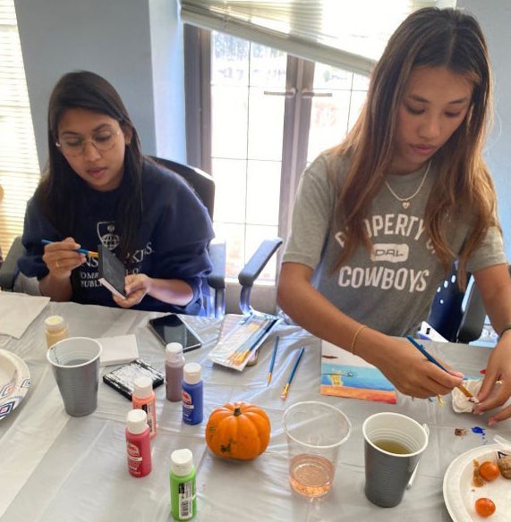 two girls painting