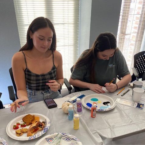 two girls painting