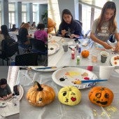 Students painting pumpkins